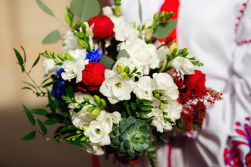 Wedding bouquet in hands of bride