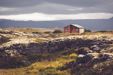 Fototapeta na wymiar Small wooden cottage in Iceland landscape