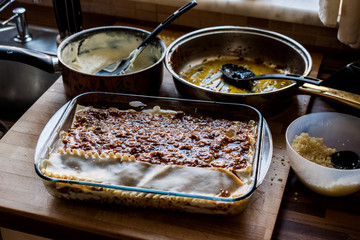 Making Lasagna Bolognese at kitchen.