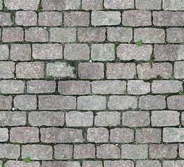 Stone pavement texture. Granite cobblestoned pavement background. Abstract background of old...