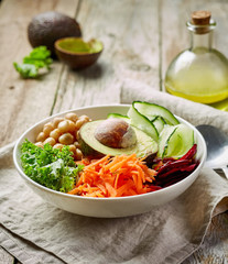 Breakfast vegan bowl for healthy eating on wooden kitchen table