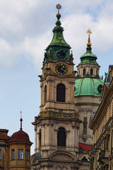 Fototapeta na wymiar Beautiful view of the Church of St. Nicholas in the Malostranske Square. Prague. Czech Republic