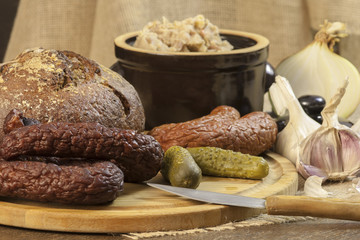 Sausage, bread, cucumbers, lard, garlic and onion