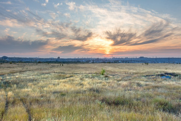 sunset over the city on a summer evening