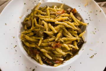 A dish of hand-made fusilli with tuna, Pachino tomatoes and parsley