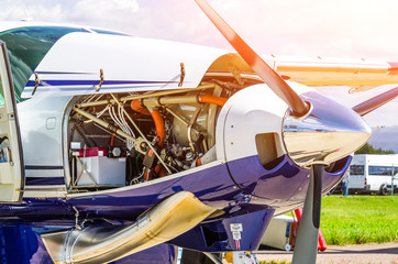 Turboprop airplane aircraft a propeller chrome luster with open bonnet repair, engine check