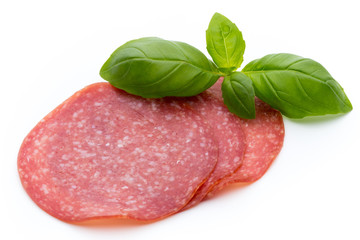 Salami slices isolated on white background.