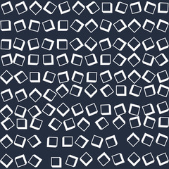 arge white cubes scattered on a dark surface