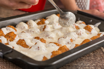 Homemade minced meat meatballs with yogurt ready for baking
