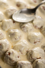 Homemade minced meat meatballs with yogurt ready for baking