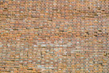 Background wall is red old bricks, orange textured fence. Architectural walls are handmade.