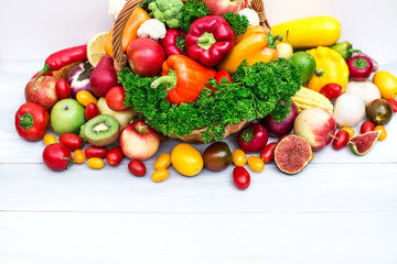 Fototapeta na wymiar Wicker basket full of organic fruit and vegetables.