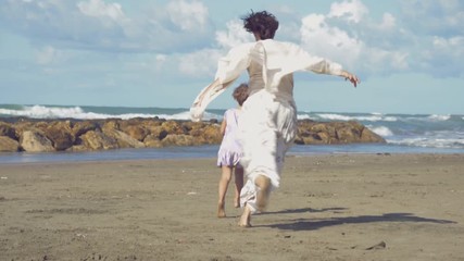 Mother chasing little daughter  playing on beach happy 4K slow motion light leaks - Powered by Adobe