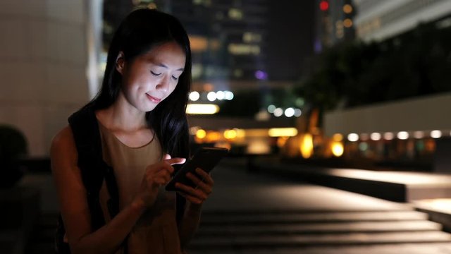 Asian Woman using mobile phone in Hong Kong