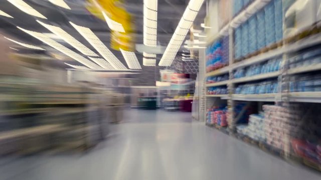 Pov. Man walking in the building supermarket. Time lapse.