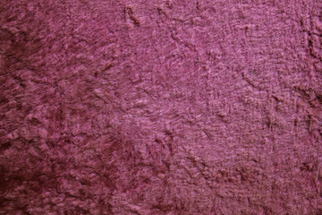 Pink surface of worn material.