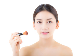 Beauty asian woman applying make up with brush isolated on white background, health clean skin concept.