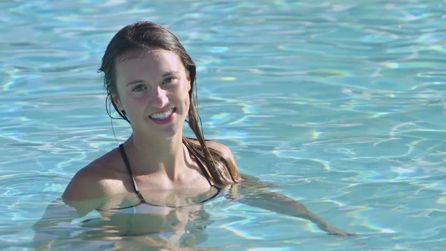 Portrait of young girl in the pool
