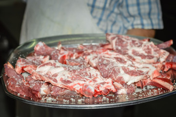 Closeup on fresh meat ready for grilling process. Cooking food dining party background concept