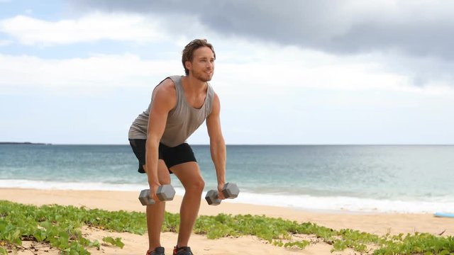 Bent Over Two Dumbbell Row Exercise - fitness man doing standing row exercise with two dumbbells AKA Bent-over Dumbbell Row or Bent over row. SLOW MOTION.