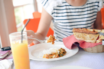Close up on glass of fresh fruits drink over light table background. Healthy positive lifestyle