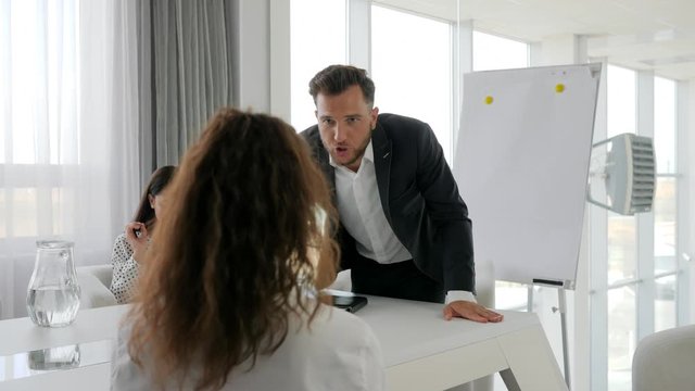 portrait rageful executive at table, Angry boss with Office subordinate in boardroom, Problems on work, Aggressive mentor with collaborators in Business center, office People at Job,