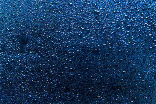 Water Drops On A Blue Slate Background