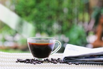 Morning coffee closeup outdoor garden blur background