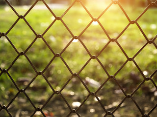 Naklejka premium Old metal fence with sunlight.