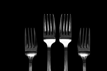 Fork background / A fork is a tool consisting of a handle with several narrow tines on one end