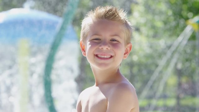 Portrait of young boy at the pool