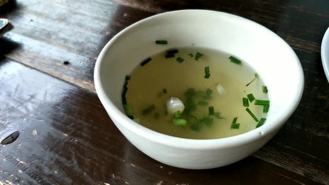 Thai vegetable soup and coriander normally served with rice and side disc