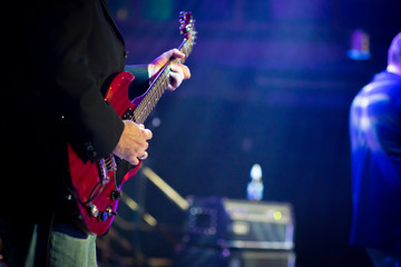 Fototapeta na wymiar Red guitar playing
