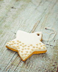 Christmas cookies star on wooden aged background