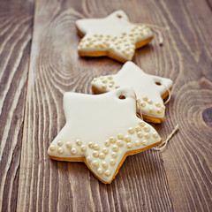 Christmas cookies star on wooden aged background