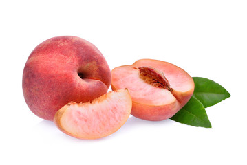 whole and half with slice of peach with green leaves isolated on the white background