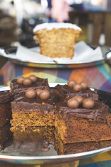 Cake Slices Topped with Chocolate Frosting and Milk Chocolate Balls