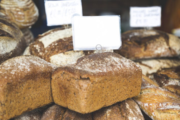 Closeup of Pile of Rye Bread Loaves Sold in Street Market