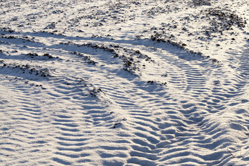 traces of the car wheels on snow