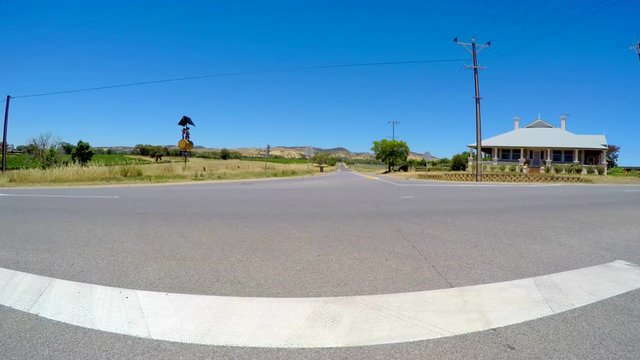 Vehicle POV driving through the Barossa Valley, winery region of South Australia.