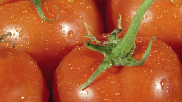Rotating closeup view of red tomatoes