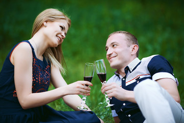 couple holding the glasses with alcohol