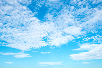 Beautiful blue sky with clouds on sunshine day. Copy space.