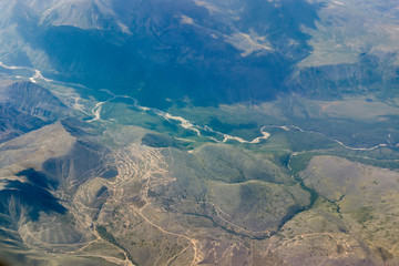 Fototapeta na wymiar River flows between the mountains