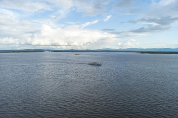 The boat floats on the  river.