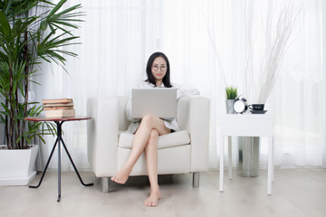 Portrait of Asian woman working at home. Woman living at home.