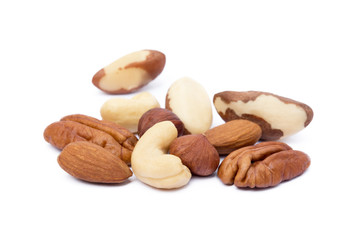 Mixed fresh nuts isolated on white background