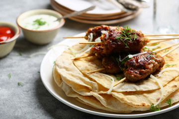 Shish kebab on stick and pita