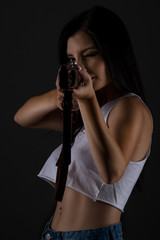 young woman with shotgun