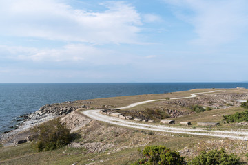 Landscape witha gravel road along the coast